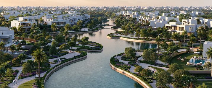 Aerial view of The Oasis canal district, where title deeds are registered remotely by power of attorney